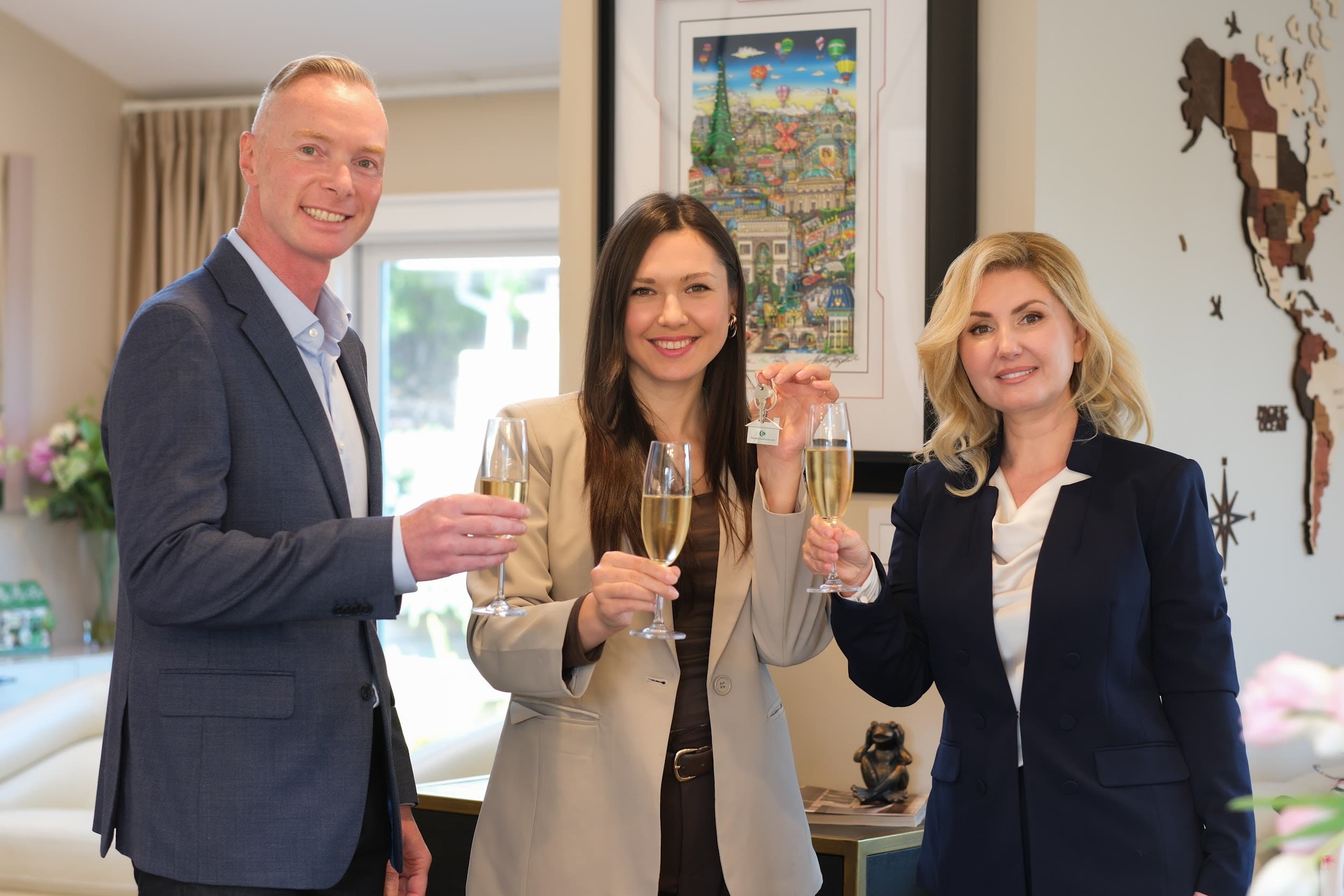 Marina Petrosov handing keys to a client